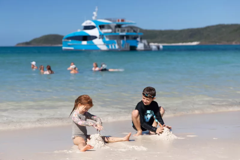 Purely Whitehaven Beach Day Tour Kids building sandcastles