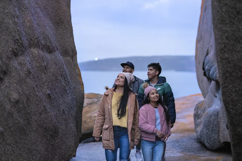 A family enjoying the view from Remarkable Rocks in Kangaroo Island