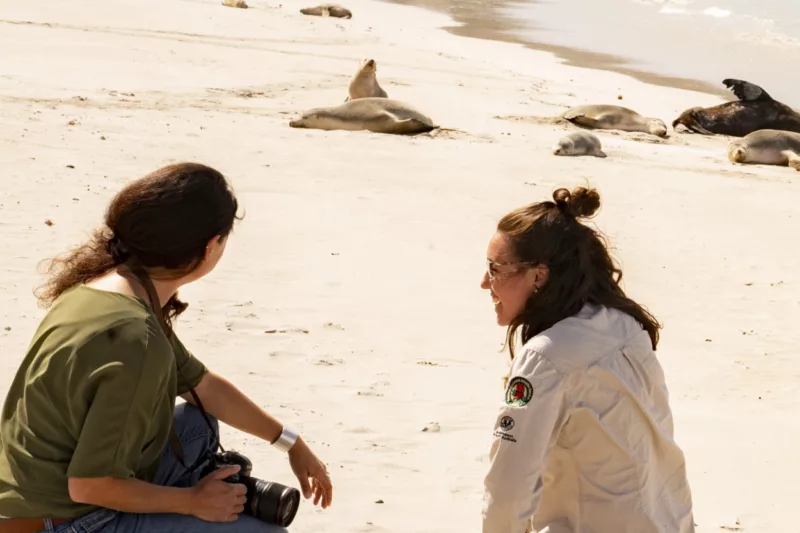 Two women admire sea lions at Seal Bay, Kangaroo Island