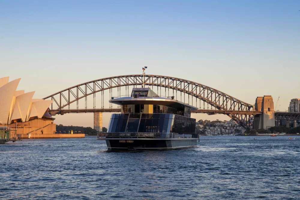 Starship Sydney on Sydney Harbour in front of the Harbour Bridge and Opera House