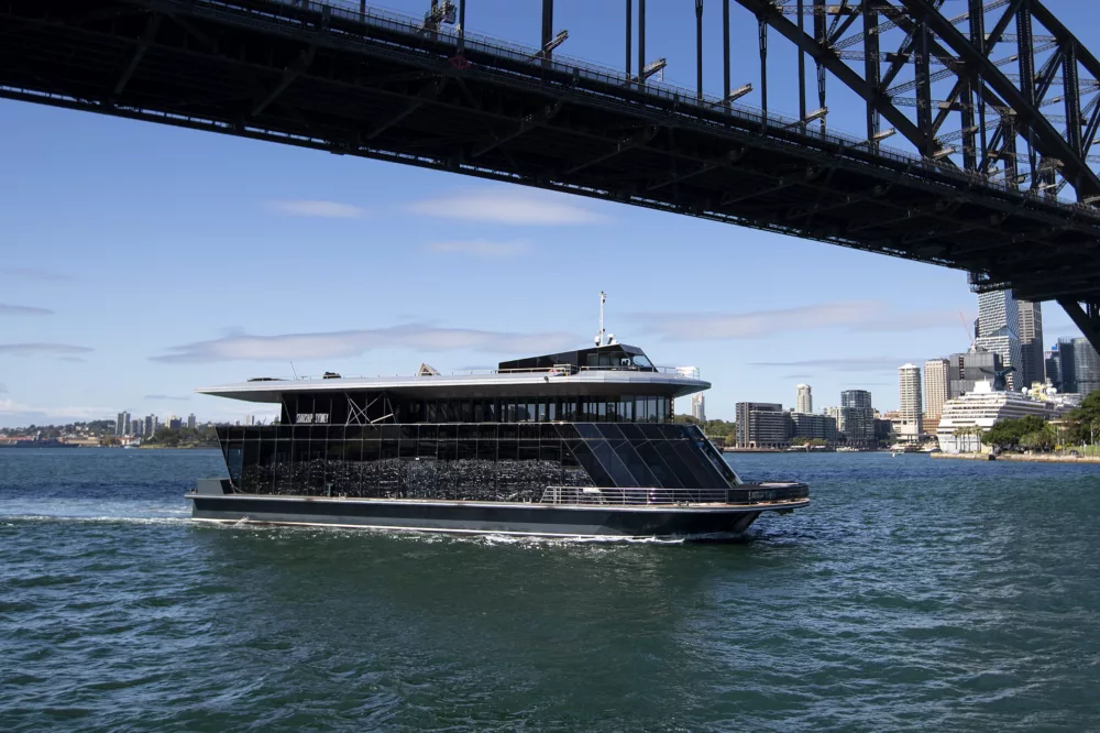 Starship Sydney cruising beneath the Sydney Harbour Bridge